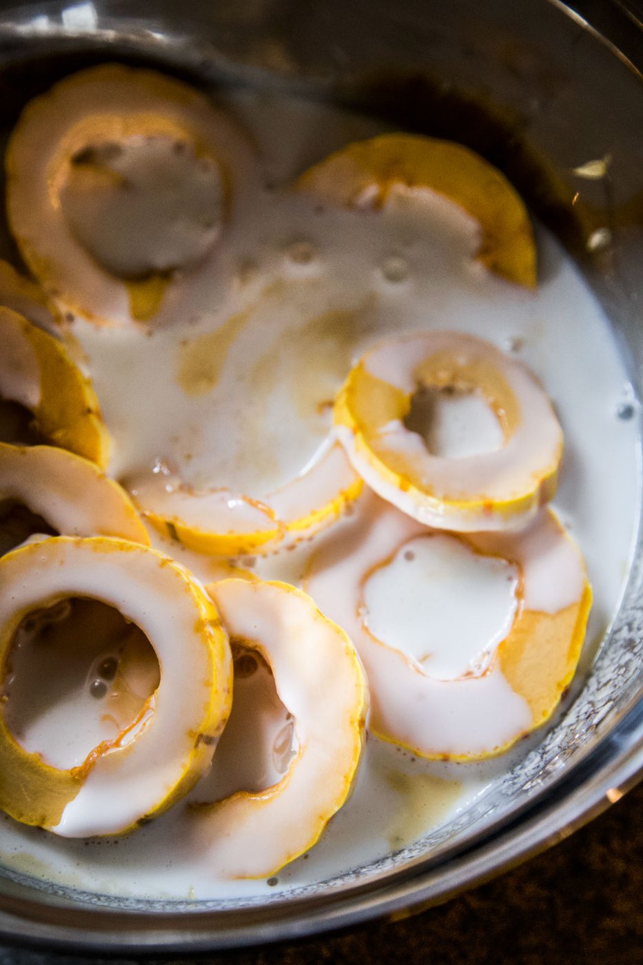 sliced delicata squash in buttermilk