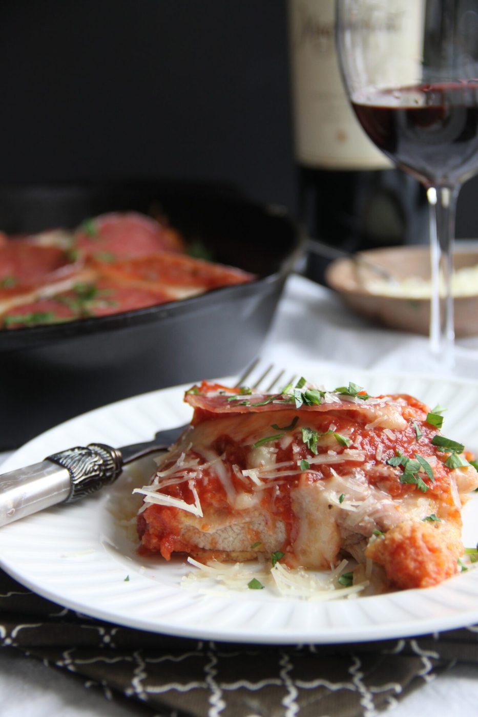 Baked chicken parmesan, finished with salami