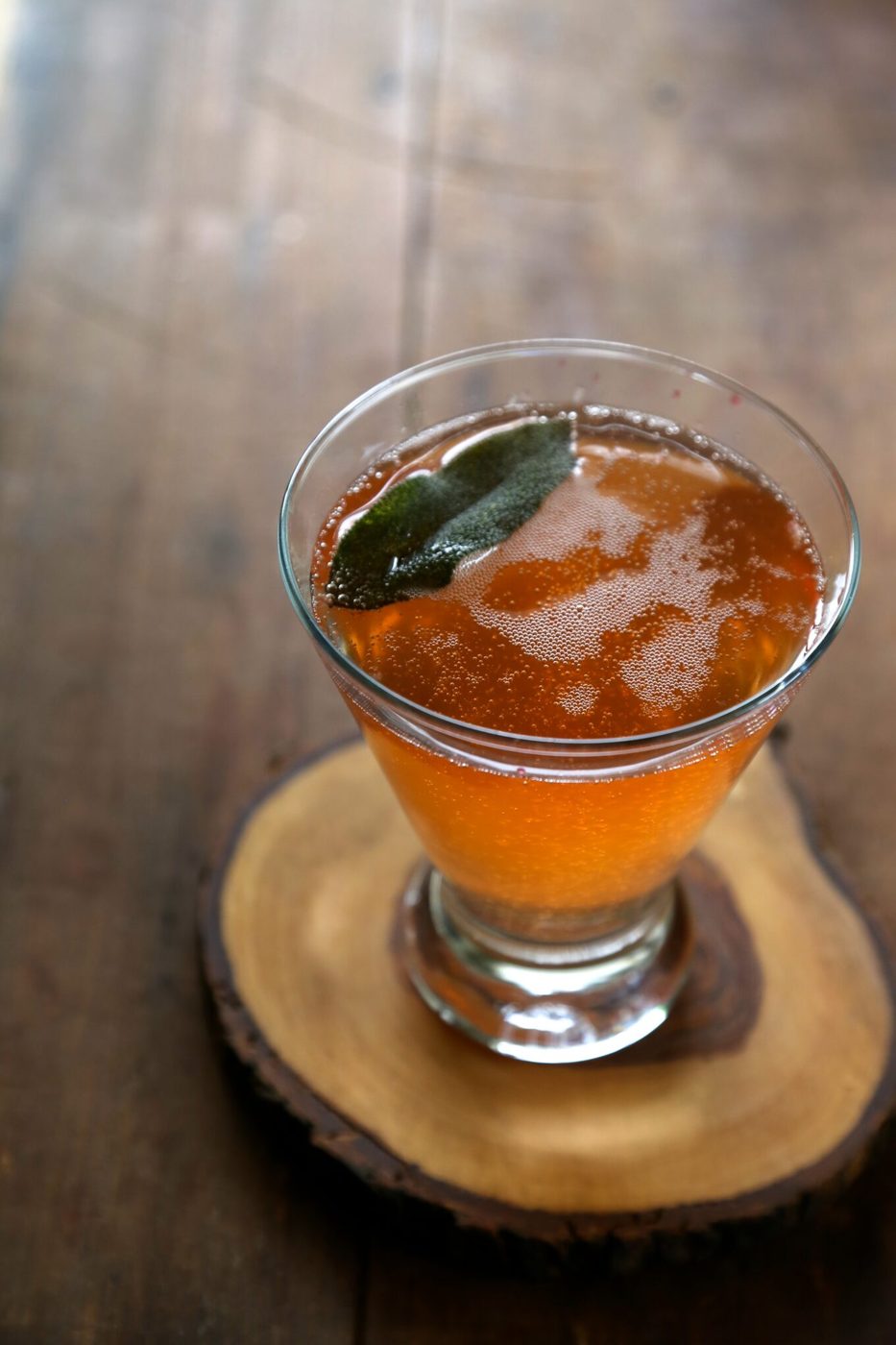 Fried sage on blood orange bourbon fizz