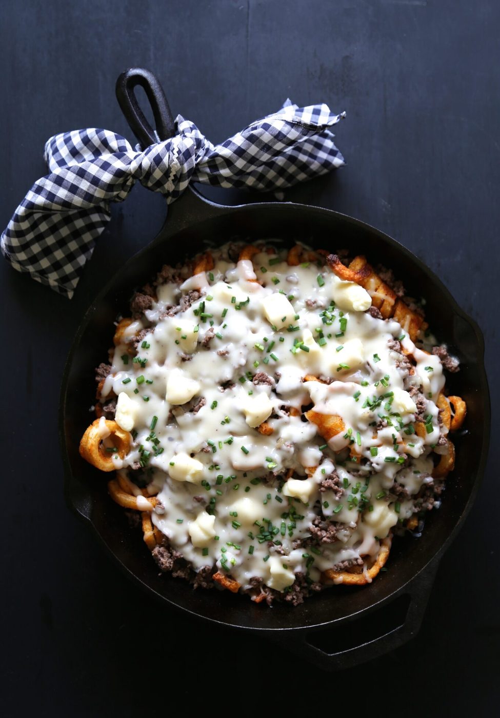 Bourbon beef poutine, finished with cheese curds & peppered gravy
