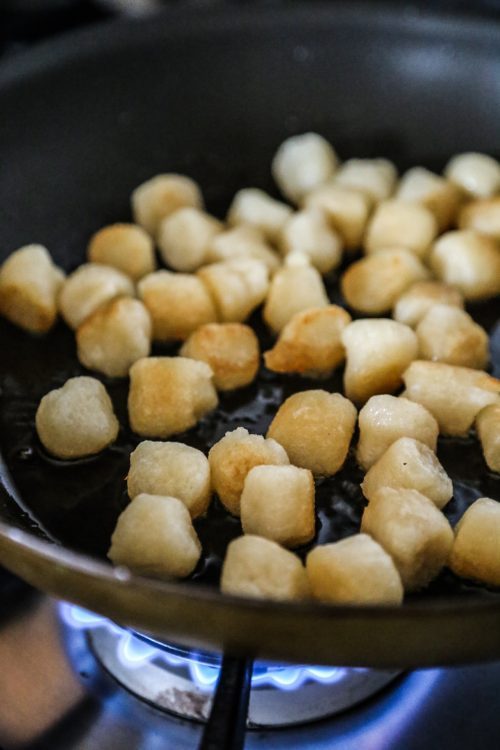 cauliflower gnocchi cooking in a skillet