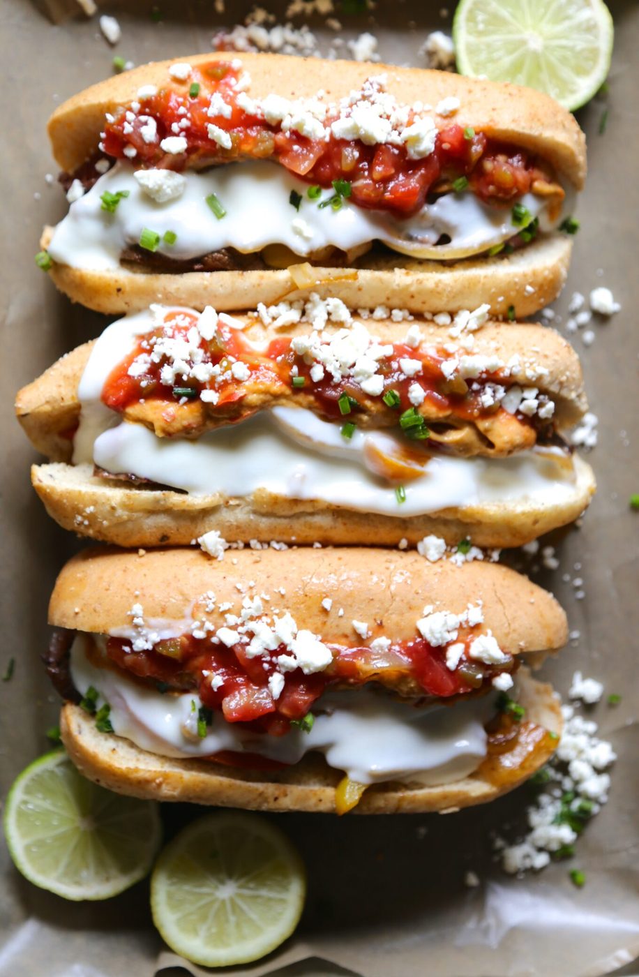 Carne asada cheesesteak hoagies, finished with chipotle hummus