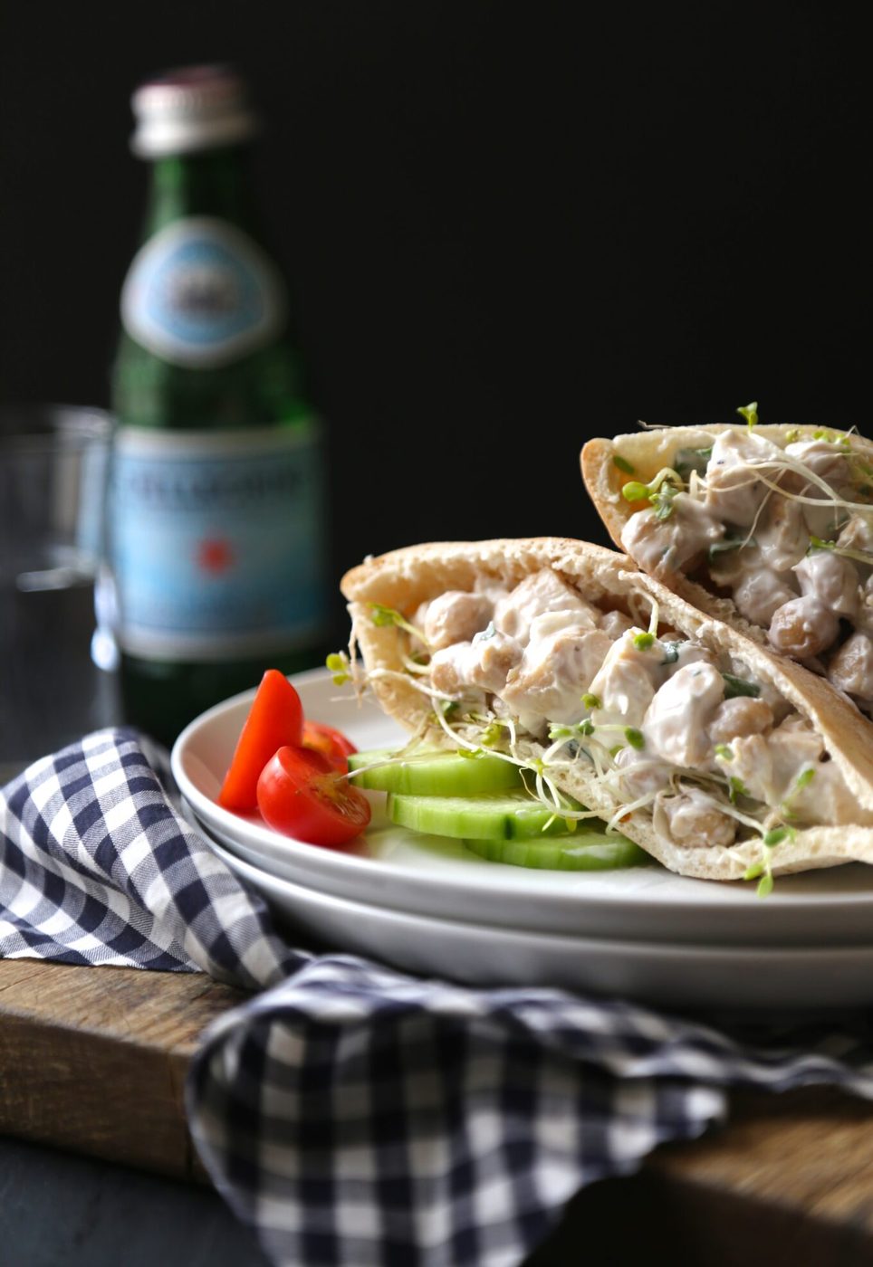 Chicken and chickpea salad pita sandwiches, finished with broccoli sprouts