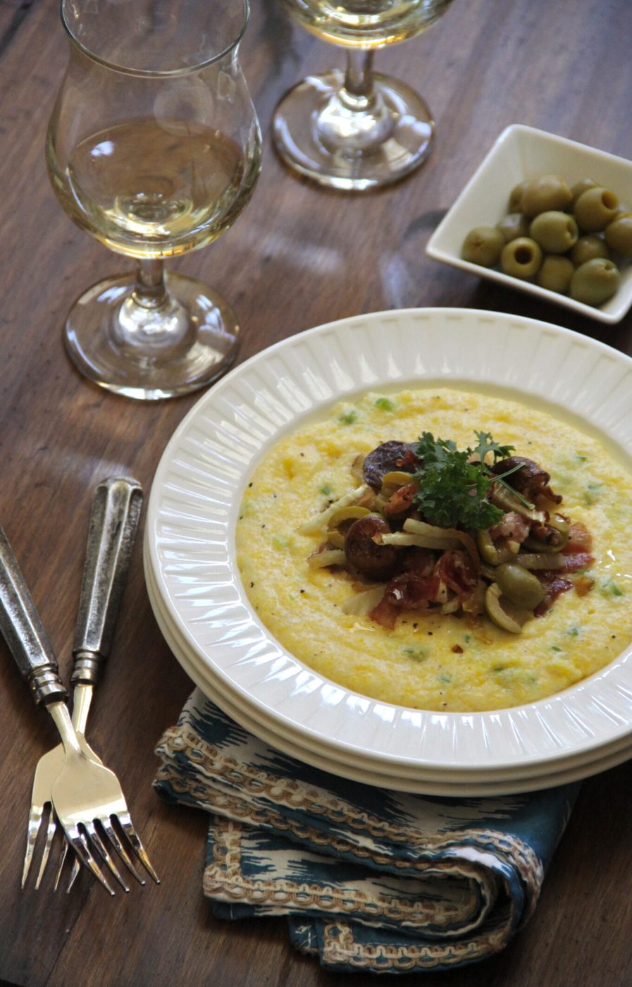 Creamy polenta, finished with caramelized fennel, bacon, and spanish olives