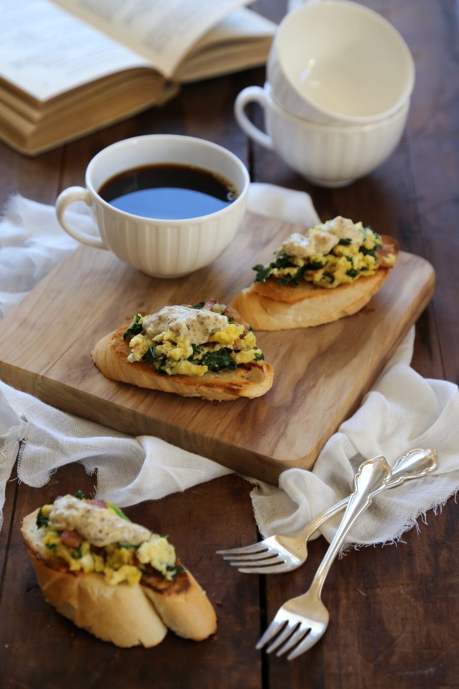 Bacon & whole grain mustard cream sauce on creamy scrambled-egg toasts
