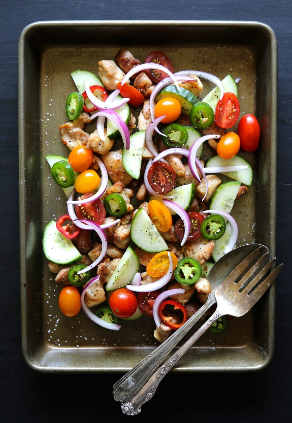 Dijon vinaigrette on crispy chicken and cucumber salad