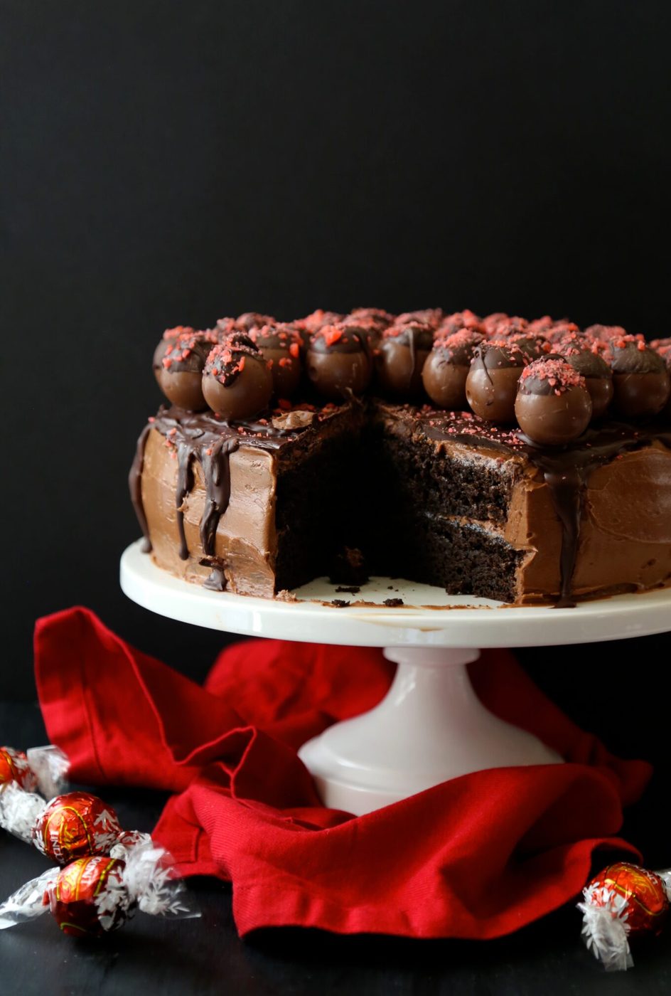 dark chocolate cake with cherry pop rocks covered truffles