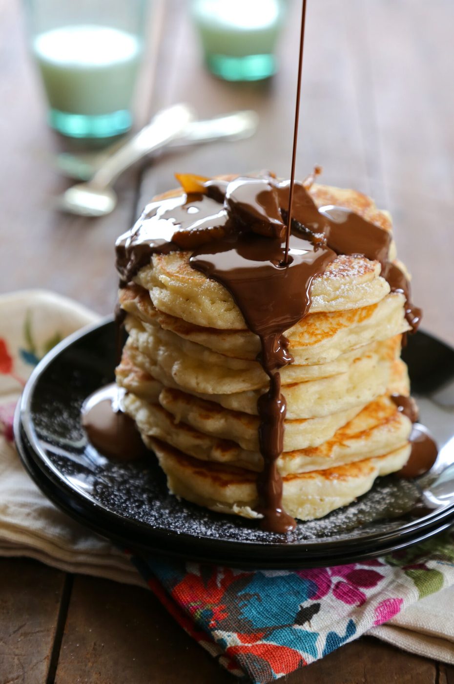 Chocolate truffle syrup and candied pears on simple buttermilk pancakes