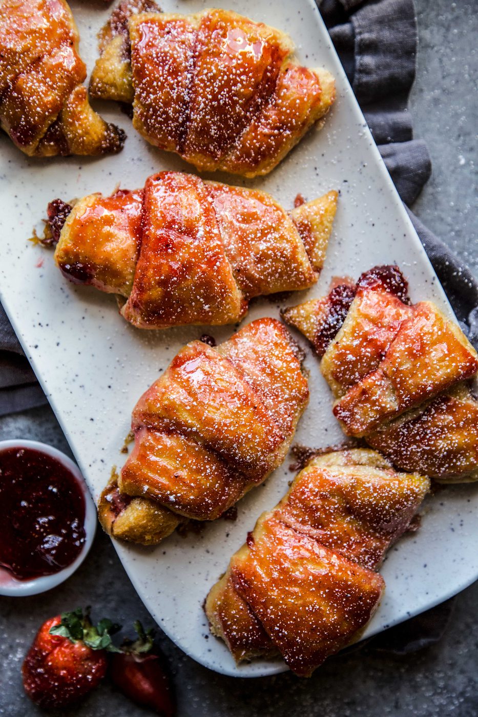 Simple Strawberry and Cardamom Croissants on a serving tray