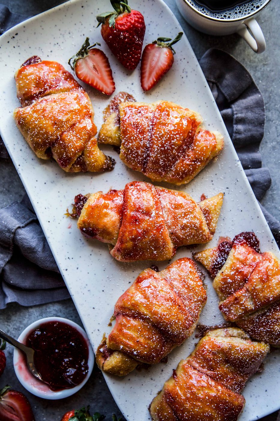 Simple Strawberry and Cardamom Croissants on a serving tray