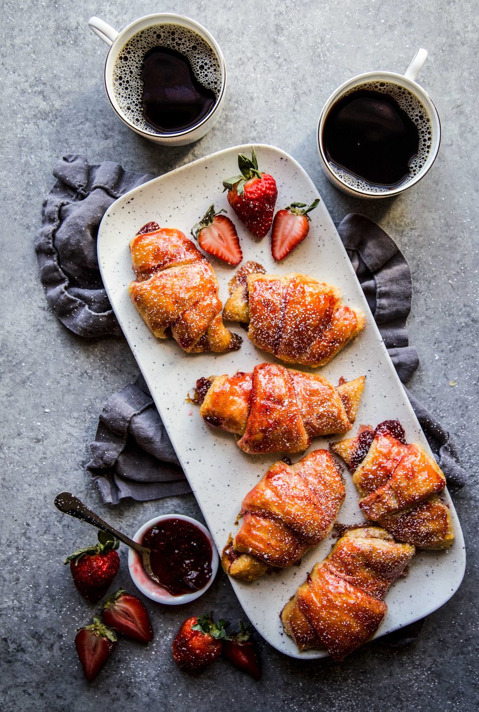 Simple Strawberry and Cardamom Croissants on a serving tray