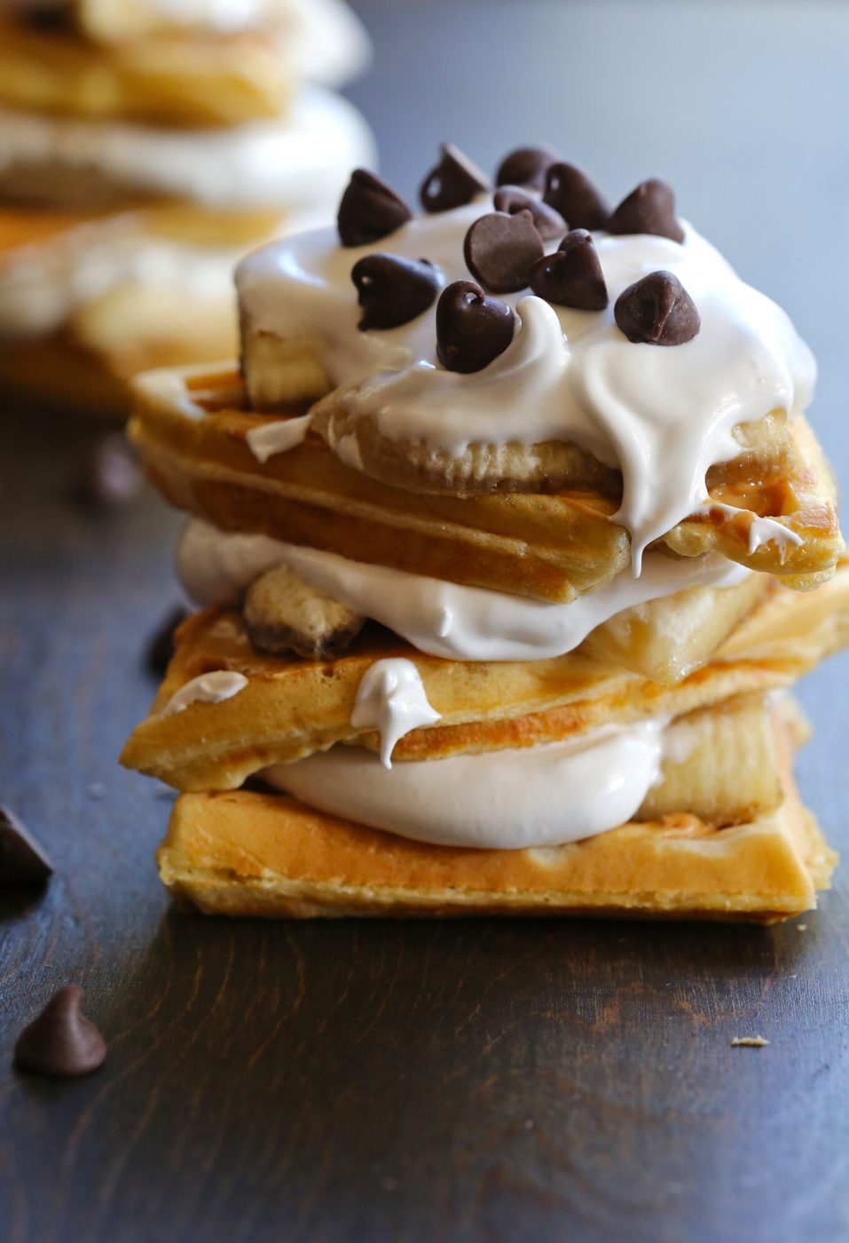 Marshmallow frosting & caramelized bananas on elvis waffle stacks