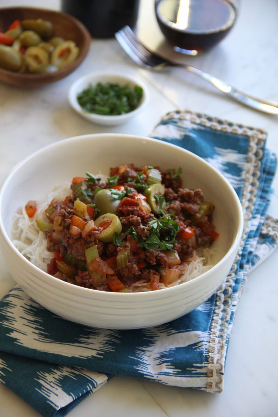 Foodie fridays: braised beef, finished with pimiento olives, red peppers, and rice noodles