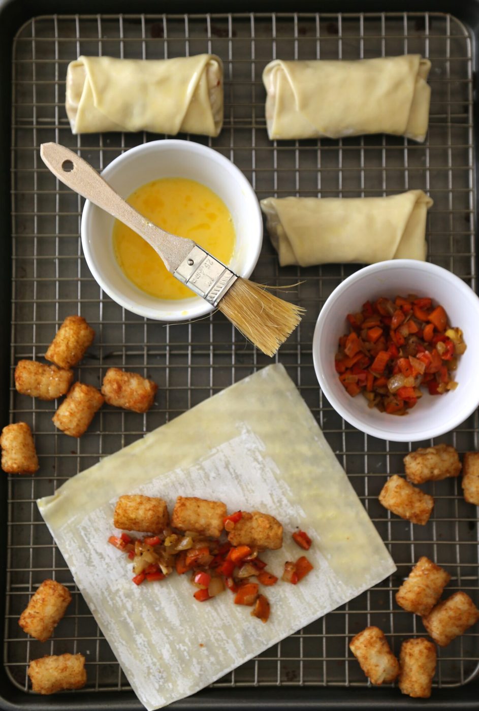 curried tater tot stuffed egg rolls with coconut dipping sauce
