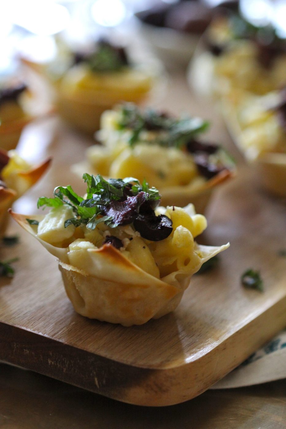 Foodie fridays: greek mac and cheese wonton bites, finished with crumbled feta + mint