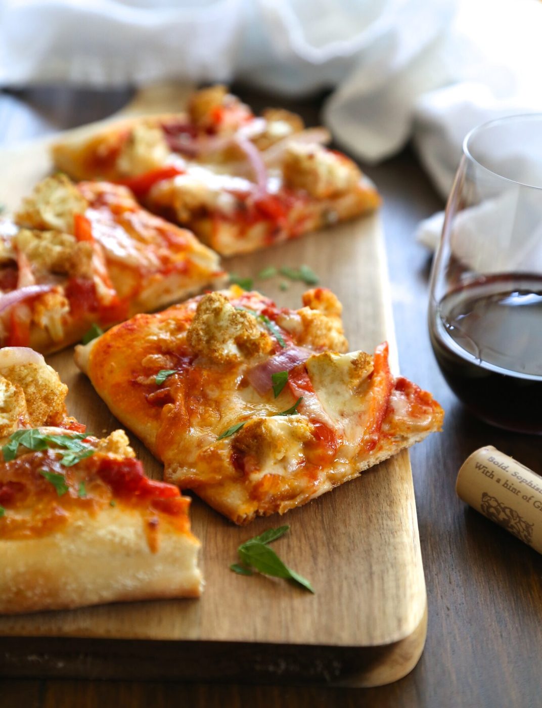 Harissa pizza, finished with Moroccan spiced cauliflower & red peppers