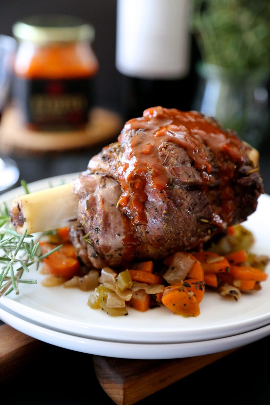 Harissa wine sauce on herb roasted lamb shanks