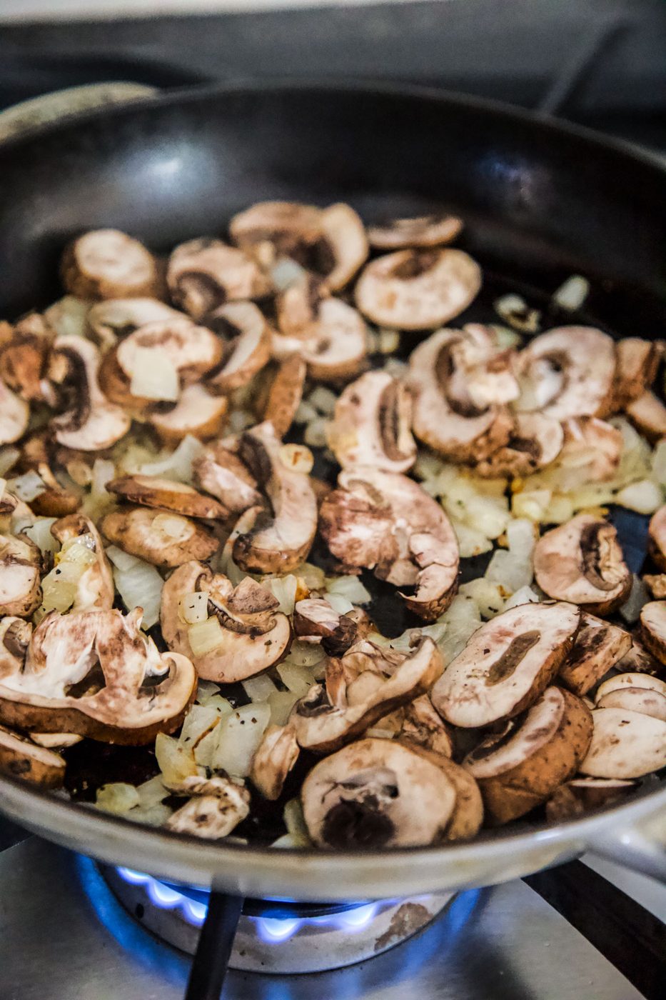 onions and yellow onions sauting in skillet