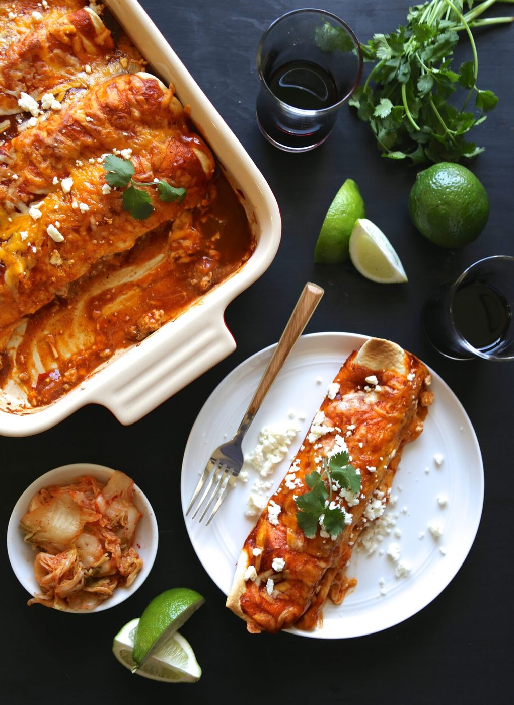 Kimchi pork enchiladas, finished with queso fresco