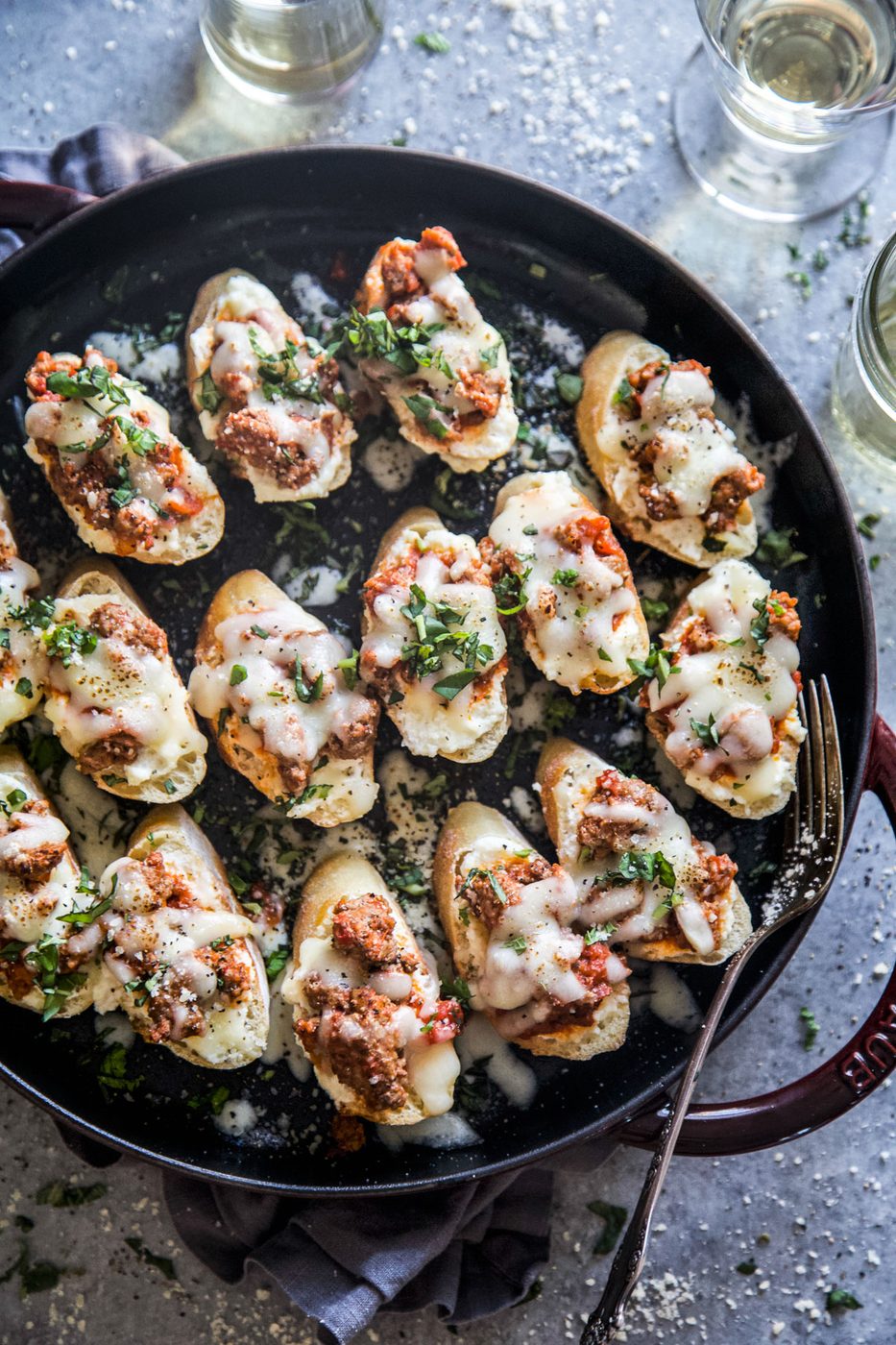 These Lamb Lasagna Crostini are meaty and cheesy Italian appetizers that are reliable for parties, picnics, and potlucks! They are made of crispy toasted bread slices topped with scrumptiously spiced and saucy ground lamb and three kinds of cheese. You’ll have these savory baked bites done in just 30 minutes!