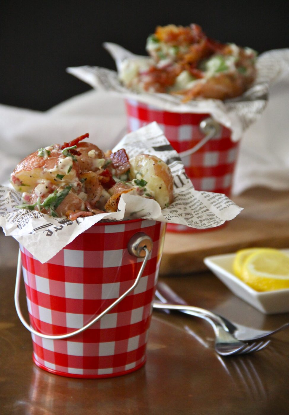 Crispy bacon on lemon herbed potato salad