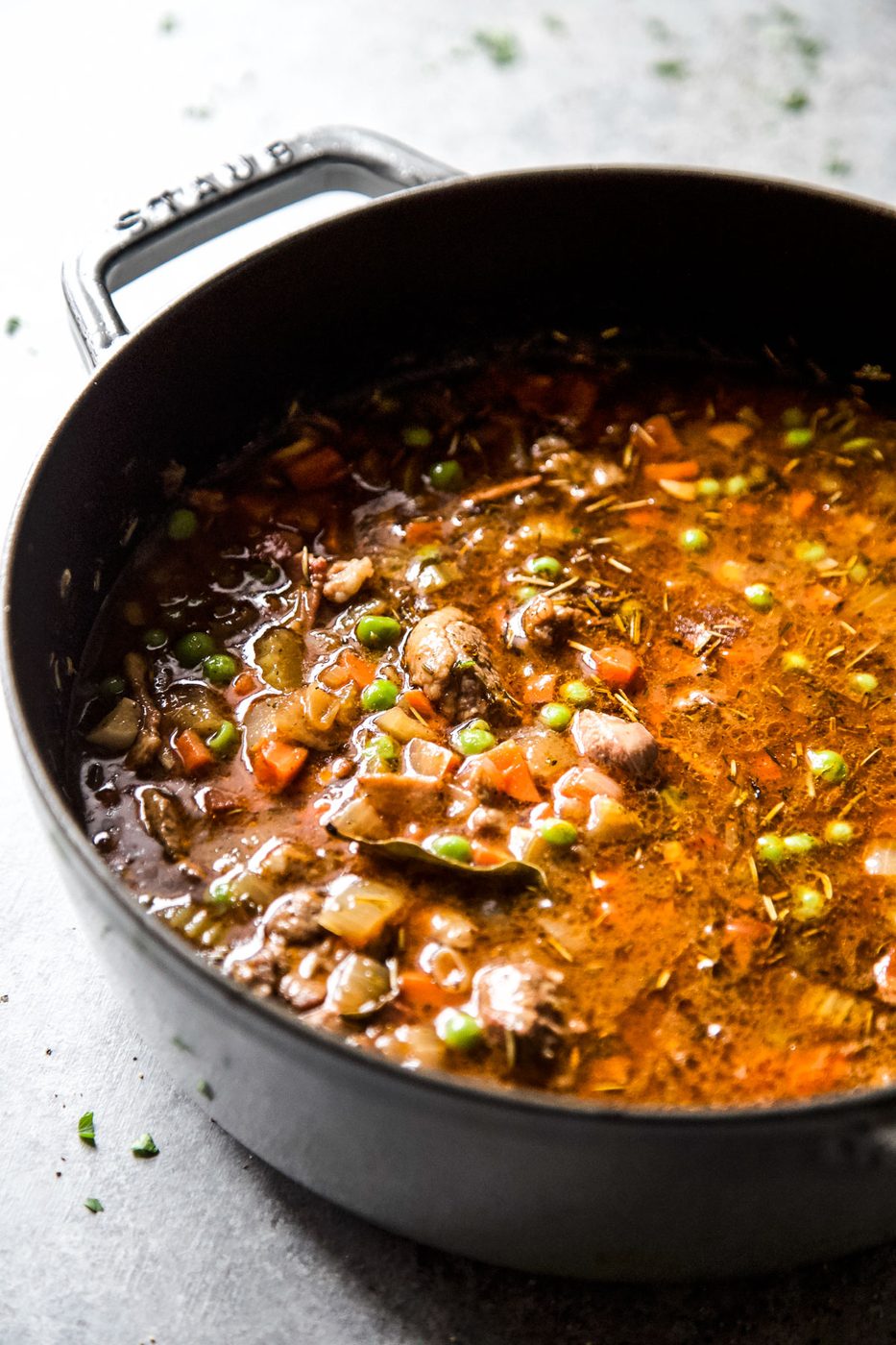 lamb shoulder simmering in a pot