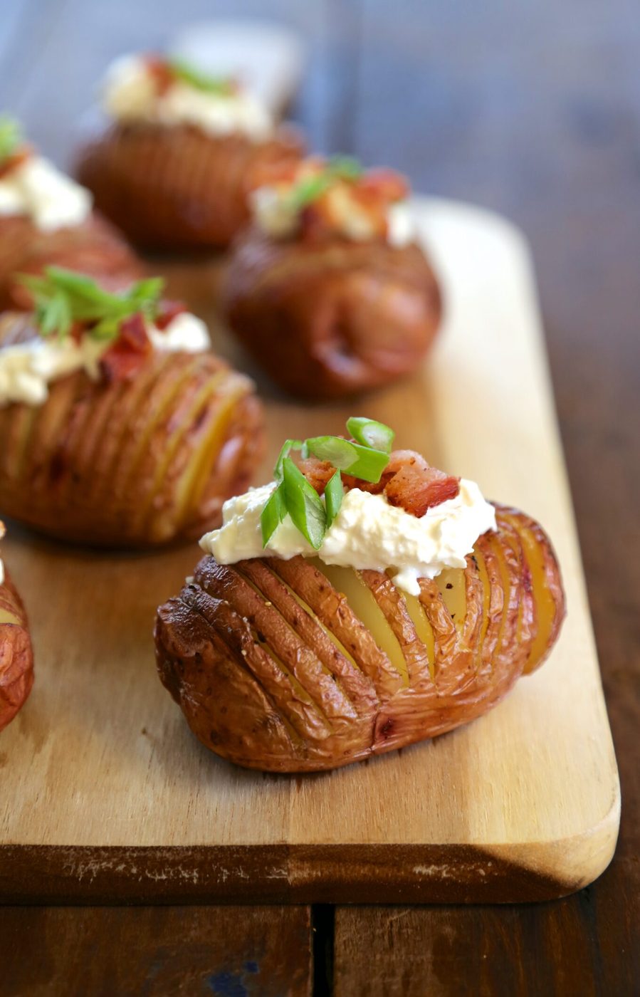 Mini hasselback red potatoes, finished with burrata & bacon