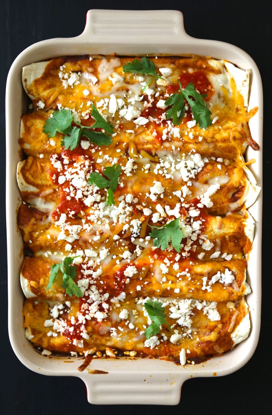 Moroccan spiced chicken enchiladas, finished with harissa red sauce