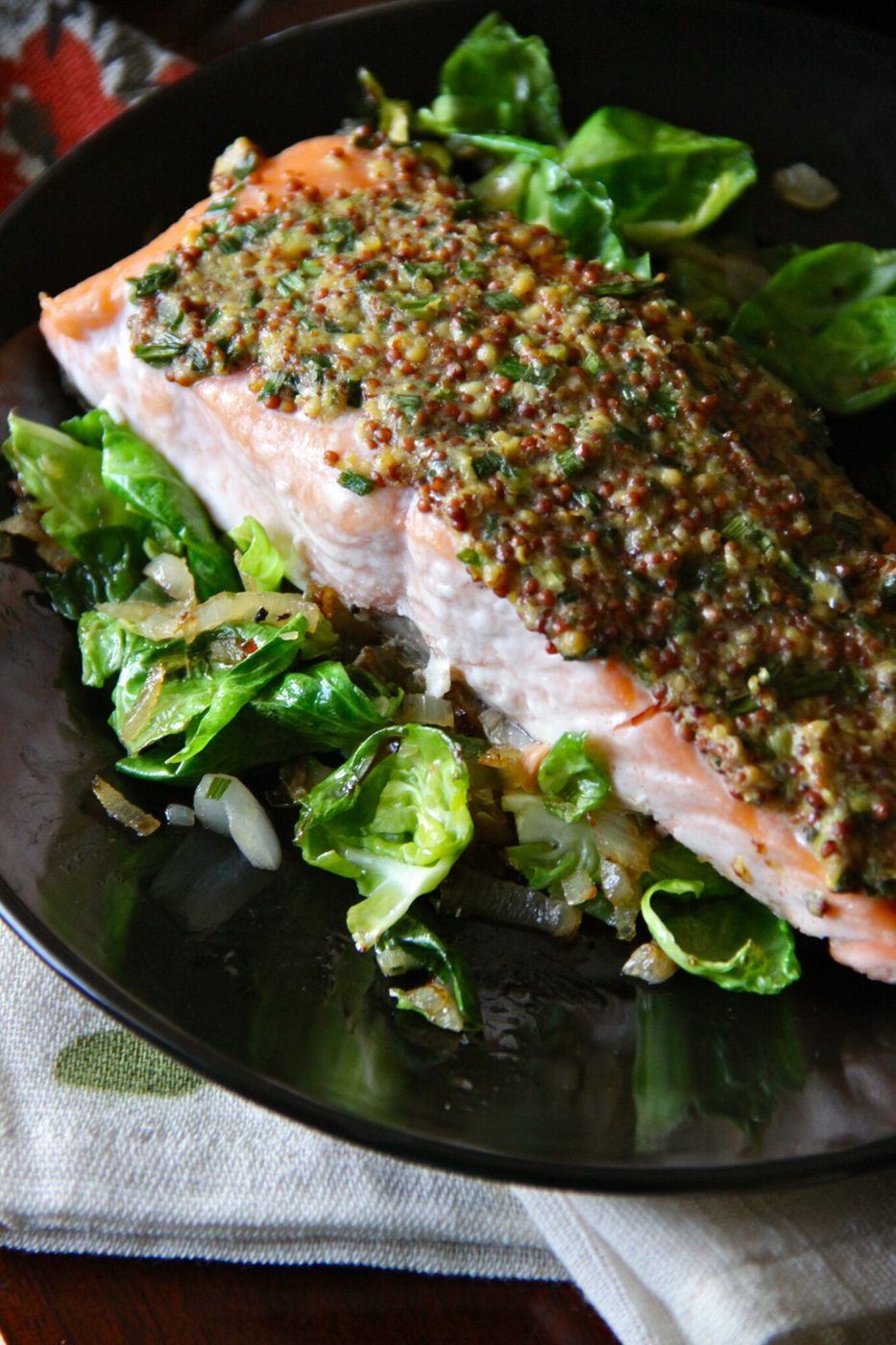 Shallots and brussel sprout leaves on mustard glazed salmon