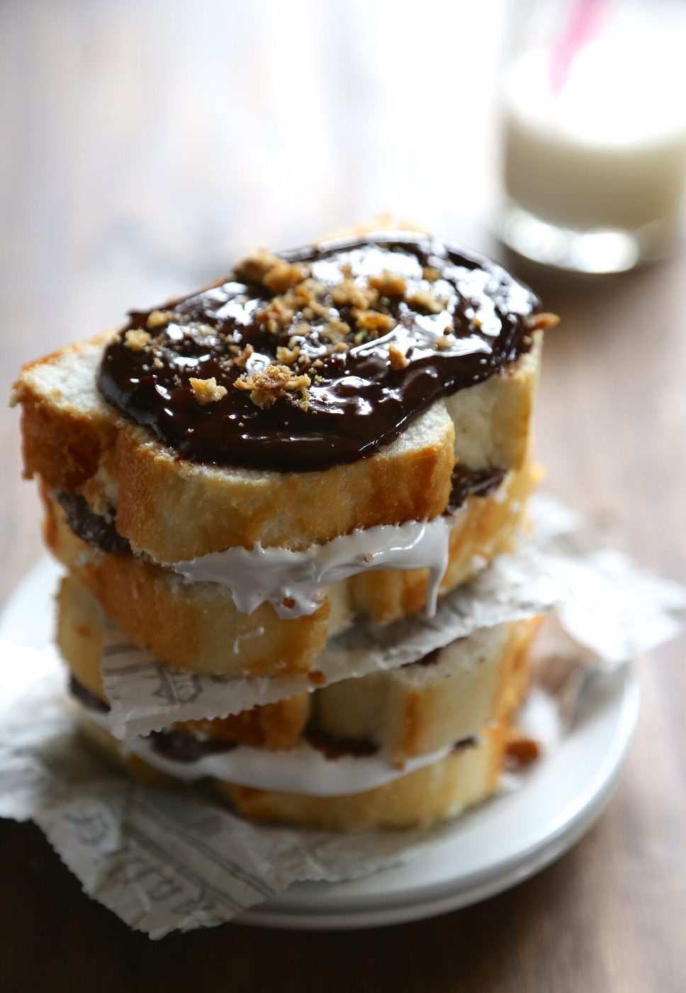 Marshmallow frosting on nutella s’more angel food cake sammies