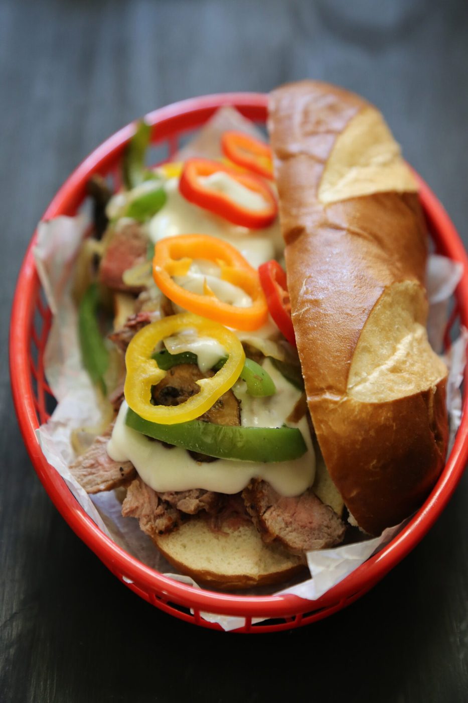 Kitchen-made Philly Cheesesteaks, finished with Provolone Sauce
