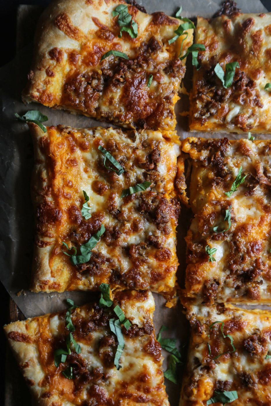 Sweet potato bechamel on sausage & smoked mozzarella pizza
