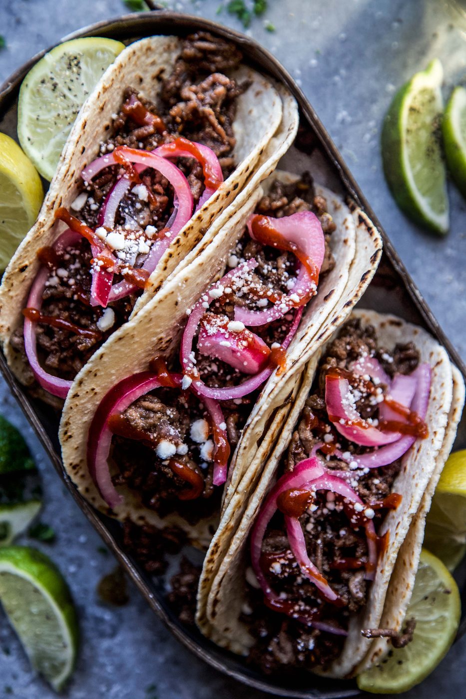 Sesame Beef Tacos with Speedy Pickled Onions on a plate