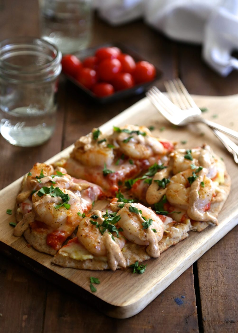 Cajun remoulade sauce on shrimp and grit naan pizza