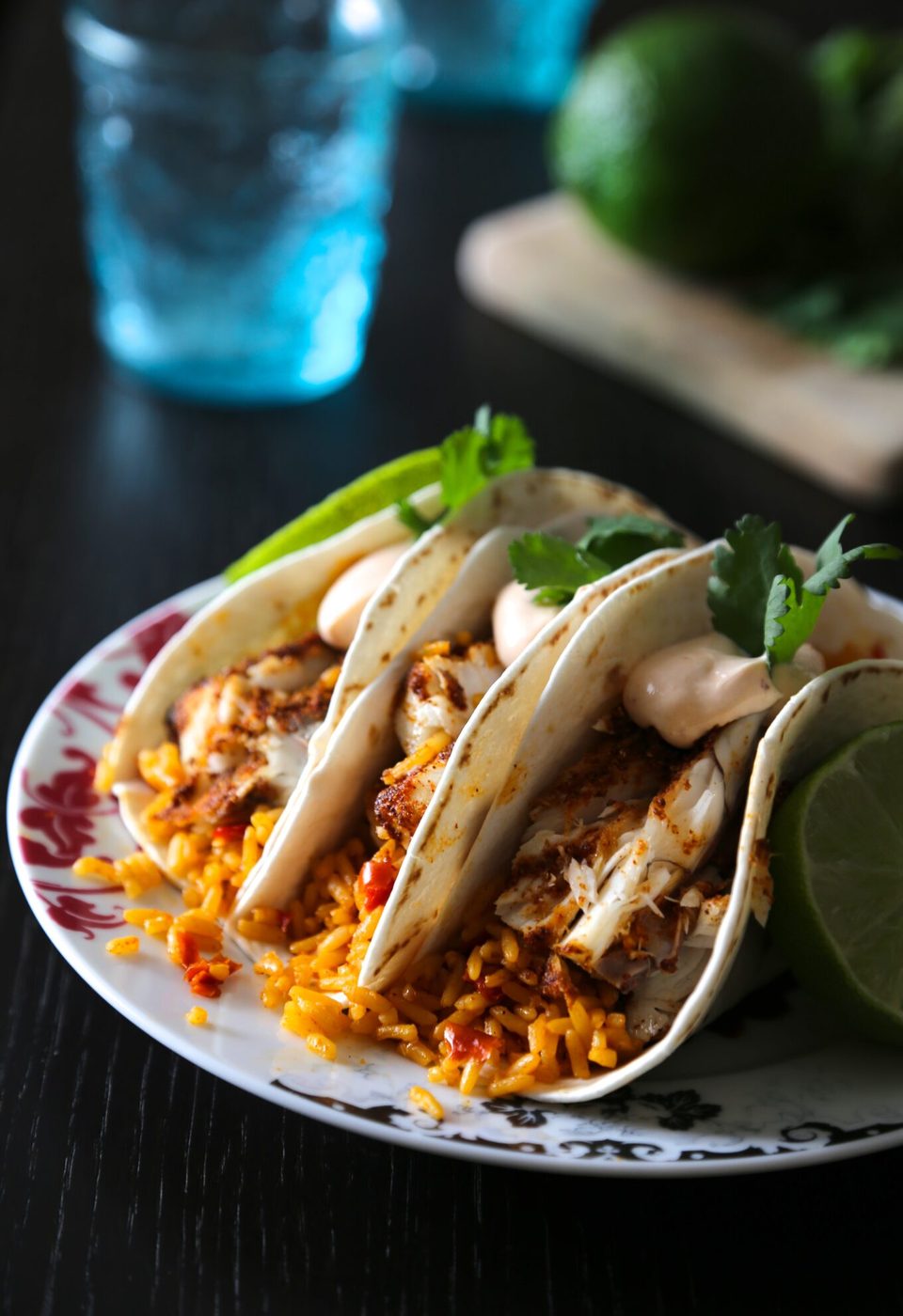Spanish rice & chipotle cream on spiced barramuni tacos