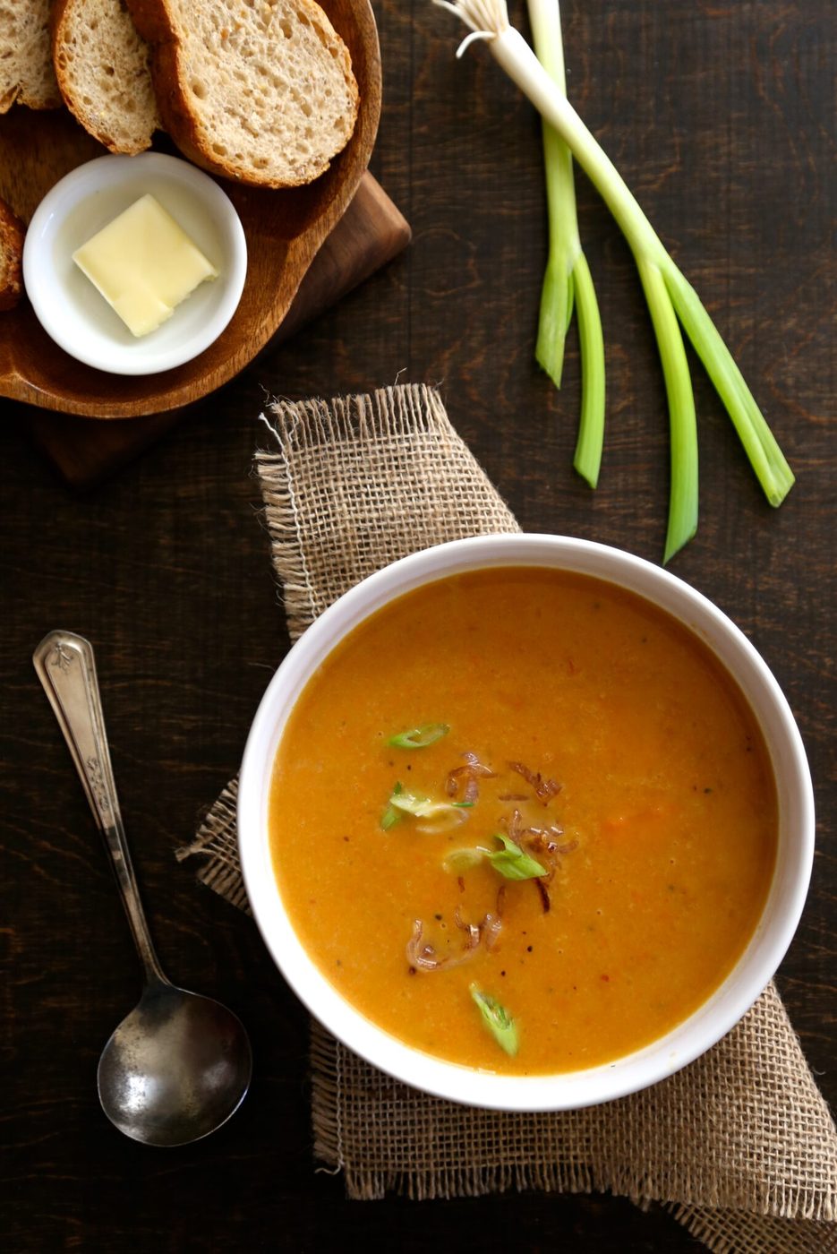 Fried shallots on spicy coconut carrot soup