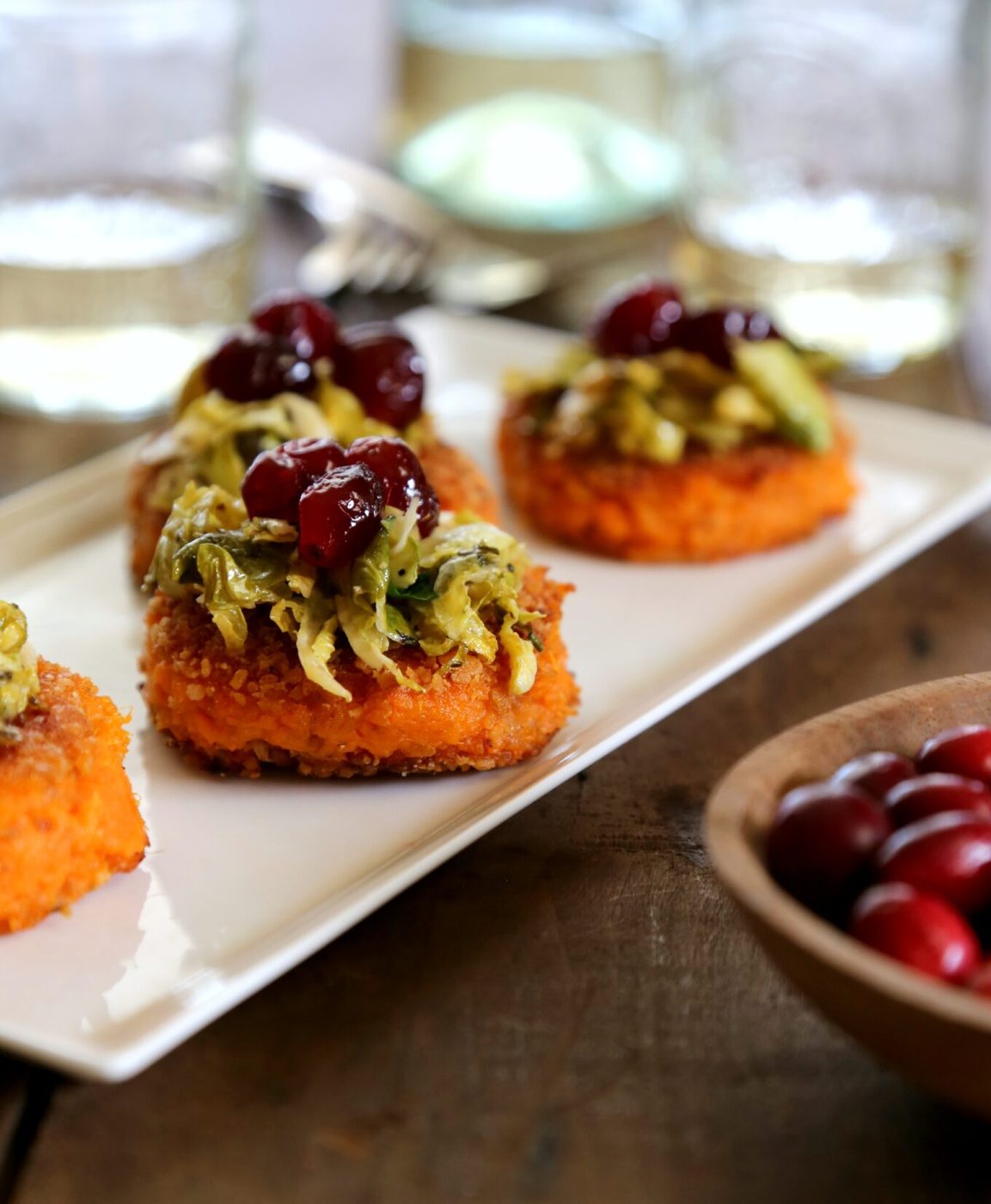 Apple cider brussel sprouts & cranberry gastrique on sweet potato bites