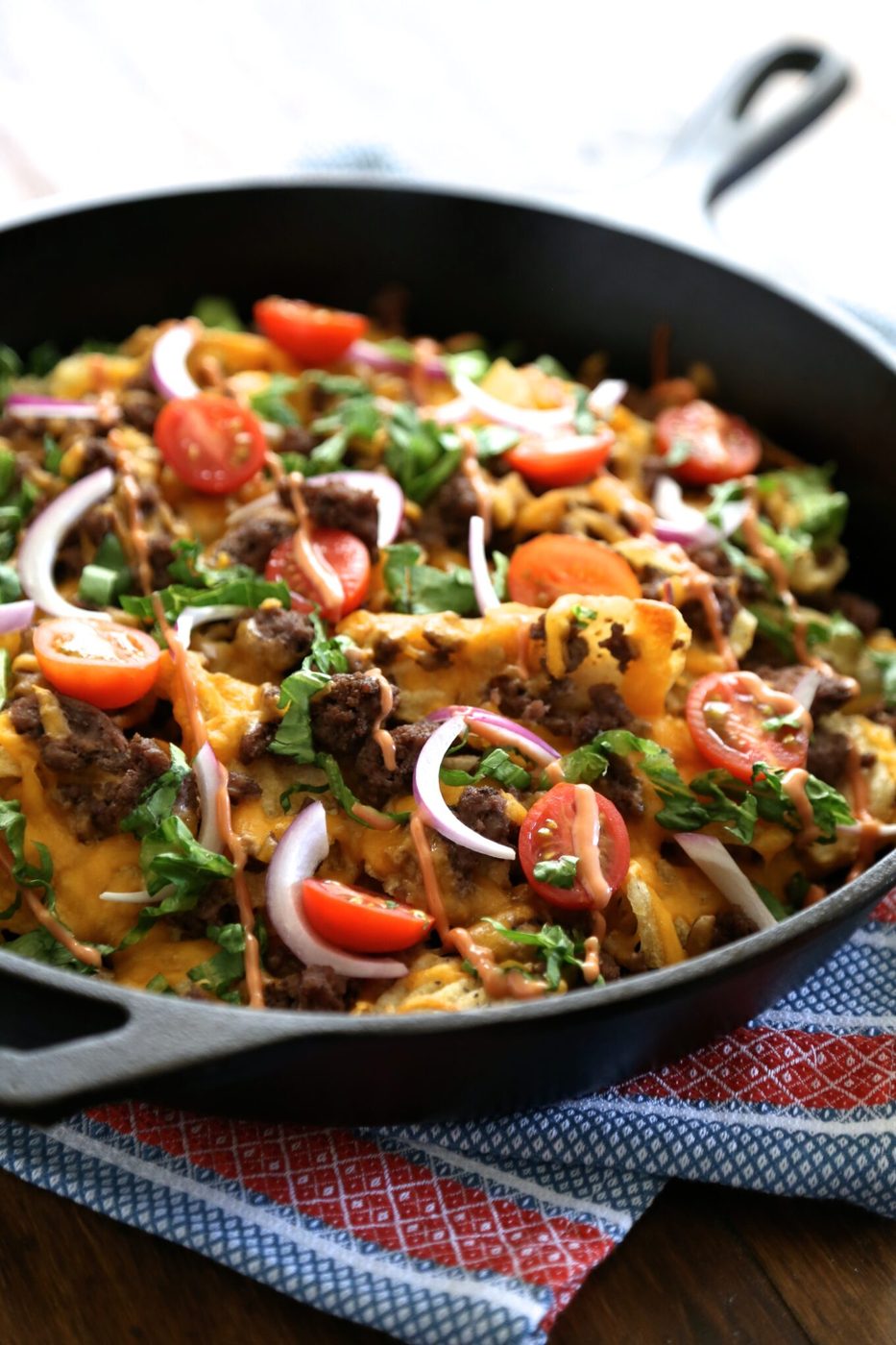 Kobe beef skillet nachos, finished with kettle chips & fry sauce