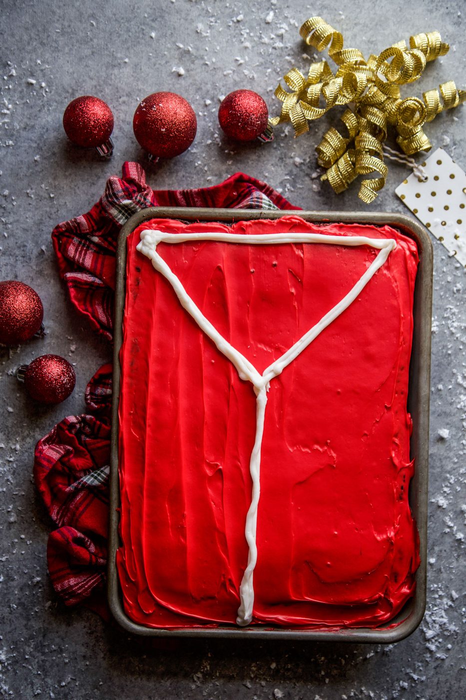 chocolate sheet cake frosted with an outline of the sweater