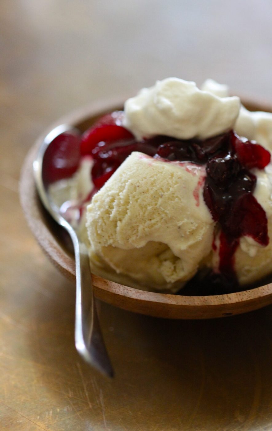 Vanilla gelato, finished with peach-berry compote & honey whipped cream