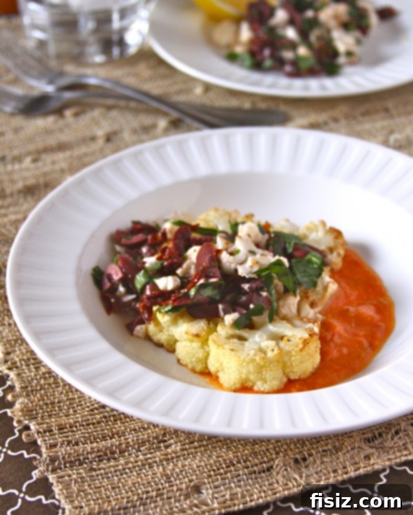 Garnished Cauliflower Steaks A vibrant close-up of pan-roasted cauliflower steaks with fresh herbs