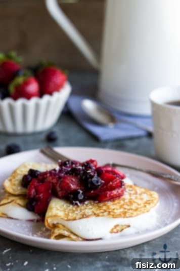 10 Delicious Mother's Day Brunch Recipes 4 Elegant Coconut Crepes with Whipped Greek Yogurt and Berry Compote, perfect for Mother's Day brunch