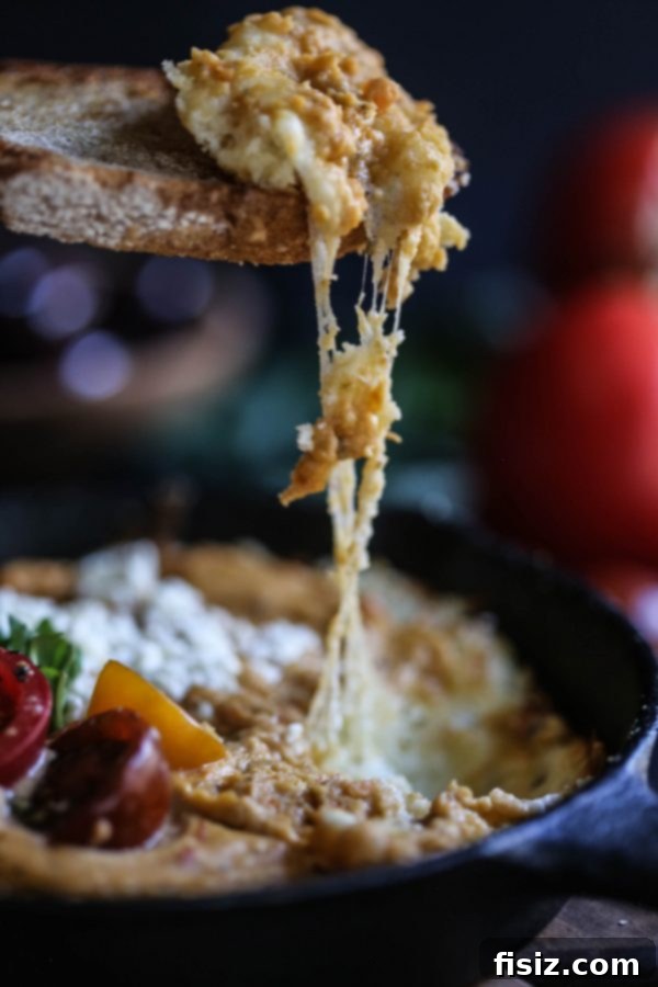Creamy Four Cheese Greek Pizza Dip with Tuscan Herb Hummus 6 Close-up of Four Cheese Greek Pizza Dip with fresh toppings