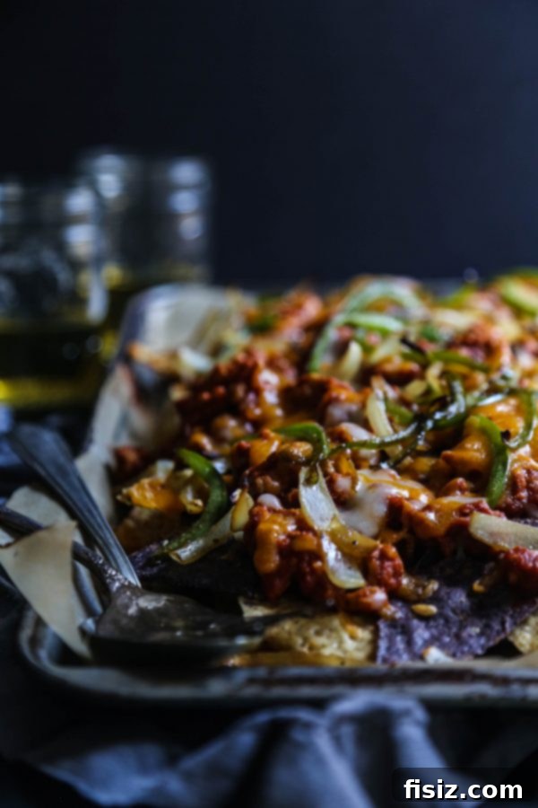 Plate of Easy Turkey Sloppy Joe Nachos with fresh toppings