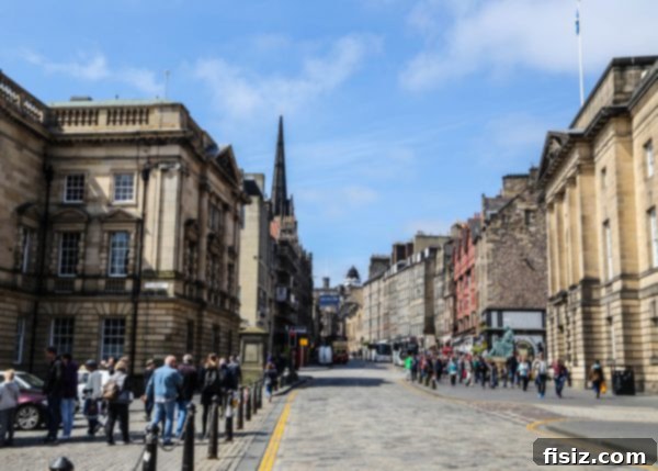 Edinburgh, Scotland: Unforgettable Stays, Delicious Eats, and Iconic Sights 11 View of Edinburgh's historic Royal Mile with a distant castle