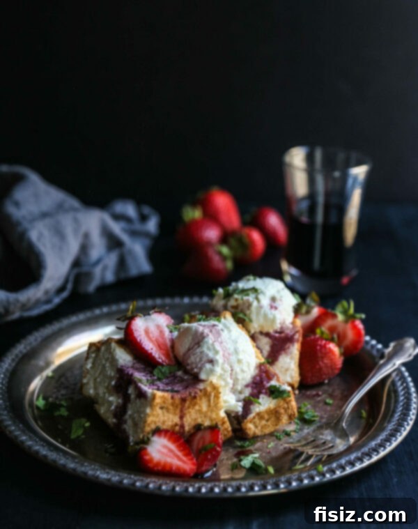 Bordeaux Berry Chèvre Mousse 2 Luxurious Goat Cheese Mousse Cakes with Bordeaux Soaked Strawberries on a plate