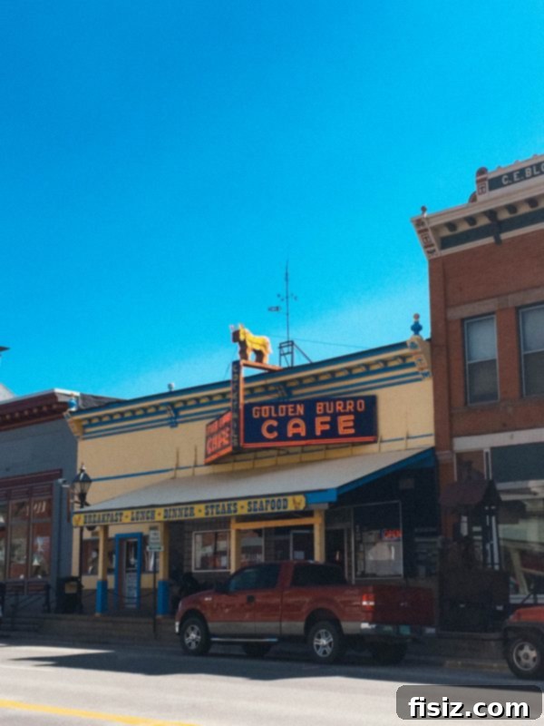 The charming and historic main street of downtown Leadville, Colorado, lined with vintage buildings and local businesses, inviting exploration.