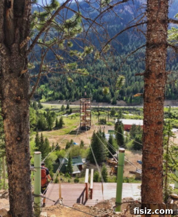 Two people enjoying a thrilling zip line ride with expansive views of the Colorado mountains and the Continental Divide near Leadville.