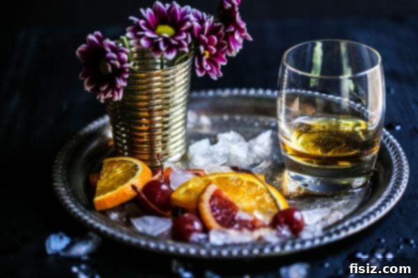 Frozen Old Fashioned 4 Ingredients for an Old Fashioned Slushie including bourbon, bitters, oranges, and ice