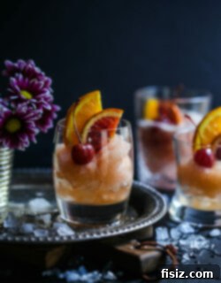 Frozen Old Fashioned 6 Finished Old Fashioned Slushie with orange and cherry garnish